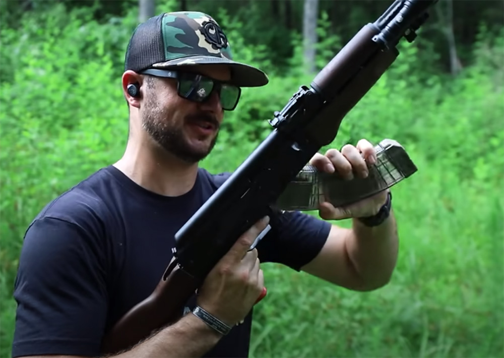 Clint loads a mag into his AK rifle